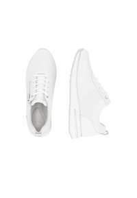 White athletic shoes made of mesh and synthetic material, featuring a slip-on design with laces and a textured sole.