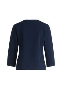 Navy blue long-sleeve top made of textured fabric, featuring a rounded neckline and rolled cuffs, viewed from the back.