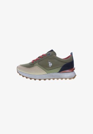 Green and beige athletic shoe with dark blue accents, red laces, and textured rubber sole. Logo on the side, smooth and durable materials.