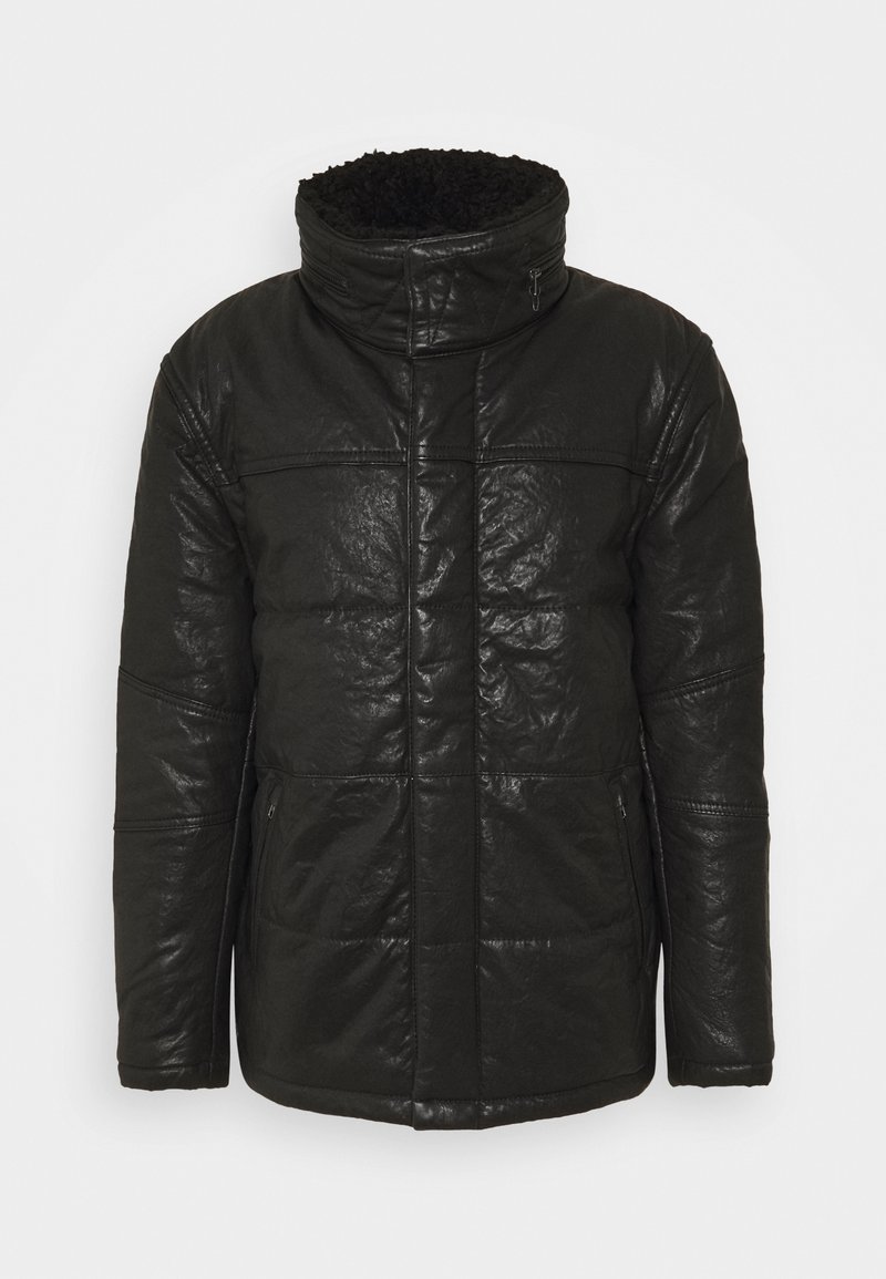 Veste en cuir rembourrée noire avec col montant doublé en polaire noire, fermeture éclair frontale et poches latérales zippées.