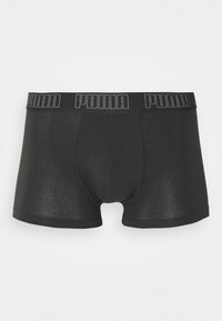 Schwarze Boxershorts aus glattem, elastischem Material. Mit einem breiten Bund, der das "PUMA"-Logo trägt. Entworfen für eine enganliegende Silhouette.