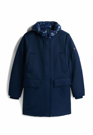 Marineblå isoleret jakke med en puffy hætte, to forlommer og lynlås foran. Har en glat tekstur og minimalistisk design.