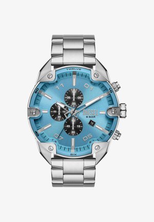 Men’s Diesel wristwatch with silver metal band, blue dial, three black subdials, date window at 4 o’clock, and silver hour markers.