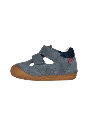 Small gray child’s shoe with brown sole, two velcro straps, open sides, padded ankle collar, and a small red tag on the heel.
