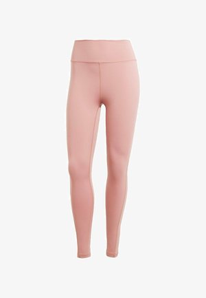 Gaiši rozā legingi, izgatavoti no elastīga auduma, ar augstu jostasvietu un gludu tekstūru ar minimālu šuvju skaitu, lai nodrošinātu elegantu izskatu.