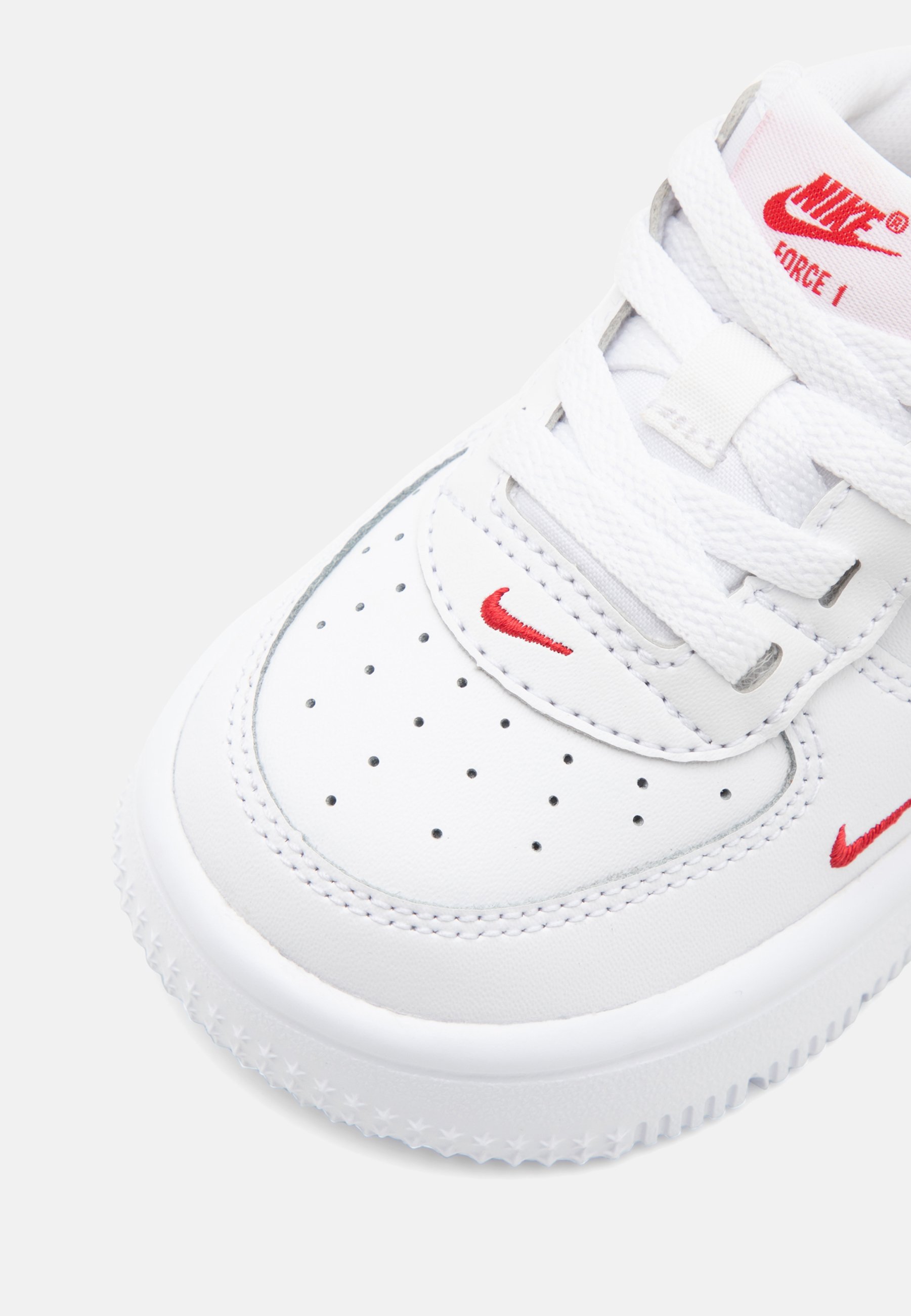 nike white shoes red logo