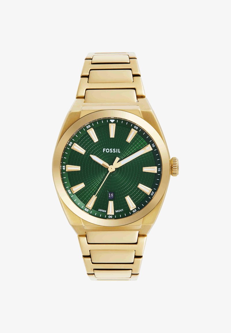 Montre-bracelet Fossil en métal doré avec cadran vert texturé, index des heures dorés et affichage de la date indiquant 18.