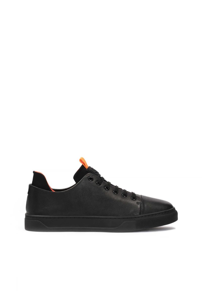 Black leather sneaker with a smooth texture, rounded toe, rubber sole, and orange accents at the heel and tongue. Classic lace-up design.