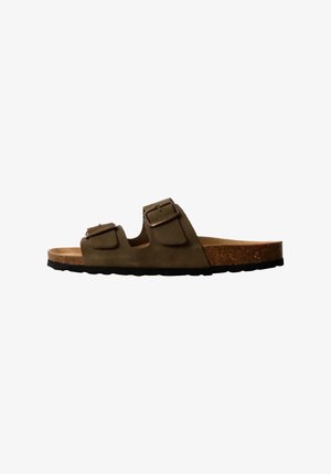 Brown suede sandals with two adjustable buckles, cork footbed, and a textured black rubber sole, designed for comfort and stability.