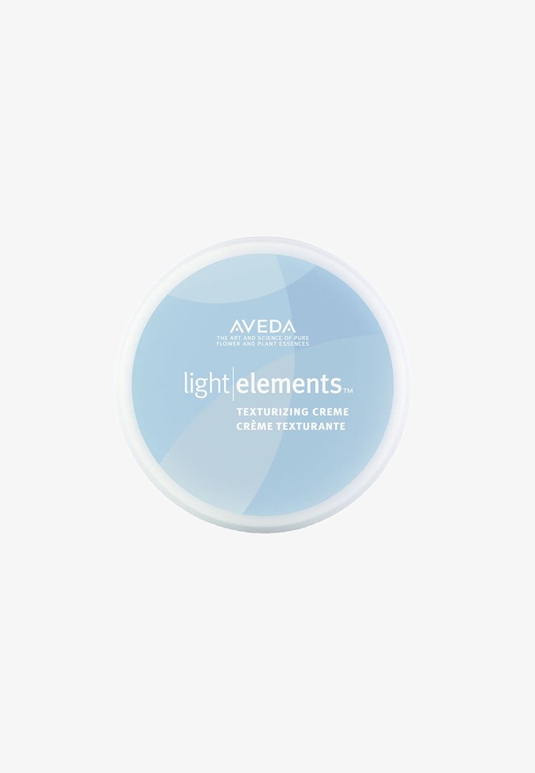 Aveda Light Elements Texturizing Crème i en rund hvid beholder med et lysblåt låg, der har hvid tekst og en glat overflade.