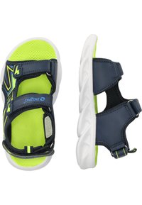 Tummansiniset sandaalit, joissa on neonvihreät pohjalliset. Niissä on kaksi säädettävää hihnaa, текстuroitu pohja ja valkoinen kumipohja.