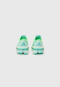 Light blue and neon green athletic shoes featuring a mesh upper, padded collar, and textured sole with a multi-directional grip pattern.