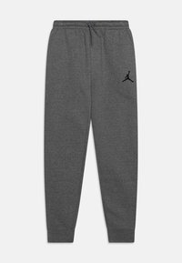 Szare dresy wykonane z mieszanki bawełny z elastycznym pasem i sznurkiem. Posiadają czarne logo Jumpman na lewej udzie. Zwężający się krój nogawek.
