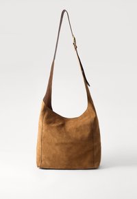 Brown suede hobo bag with a single leather shoulder strap, features a curved shape and smooth texture, minimal stitching details.