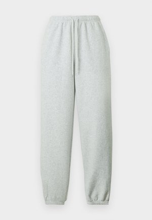 Heledatsetud hallid dressipüksid, mis on valmistatud pehmest materjalist, varustatud elastse vöörihma ja nööriga ning elastsete ääristega pahkluude juures.