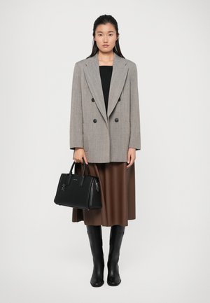Gray double-breasted blazer, black tank top, brown midi skirt, black handbag with top handles, and knee-high black boots.