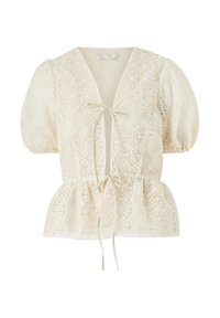 Bluse med puffærmer i creme med intrikate blonder, V-udskæring, knyttet front og peplum i taljen for en tætsiddende silhuet.