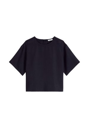 Blouse noire courte avec manches courtes larges et encolure ronde, dotée d'une fermeture éclair au dos.
