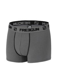 Boxers gris pour hommes avec coutures noires et ceinture élastique de marque portant l'inscription "FREEGUN" en lettres noires.
