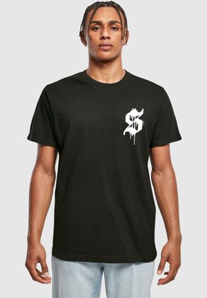 Black cotton t-shirt featuring a white graphic design on the left chest area. The fit is relaxed, with short sleeves and a crew neckline.