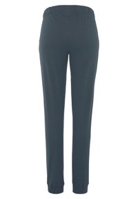 Dunkelgraue gerippte Hosen mit einem elastischen Bund, schmal zulaufenden Beinen und eng anliegenden Bündchen an den Knöcheln. Weiche Textur. Einfaches Design ohne Muster.