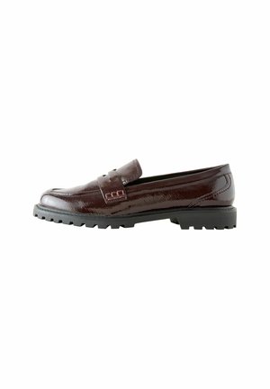 Burgundy leather loafer with a shiny finish, featuring a strap across the upper, a rounded toe, and a rugged black rubber outsole.