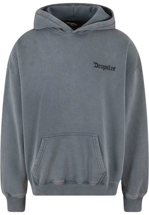 Felpa grigia in cotone con cappuccio regolabile, tasca frontale, polsini a costine e un piccolo logo nero sul petto. Tessuto morbido, vestibilità casual.