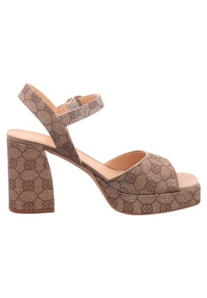 Sandalias de plataforma con estampado marrón, punta cuadrada, tacón grueso y cuadrado, correa ajustable en el tobillo y parte superior de tela texturizada.