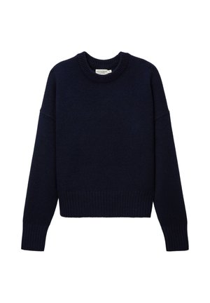 Pull en maille bleu marine avec col rond, manches longues et ourlet côtelé. Le tissu semble doux avec une finition texturée. Longueur cropped.