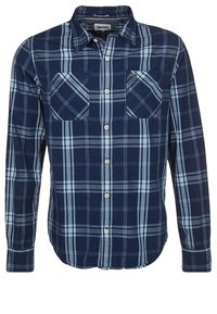 Pánská flanelová košile s dlouhým rukávem v tmavě námořnické a světle modré kostkované vzoru, se dvěma náprsními kapsami a knoflíkovým zap ínáním v přední části.