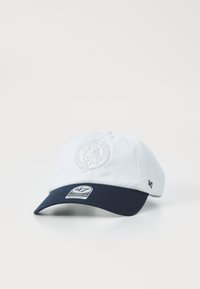 White cotton baseball cap with a navy blue brim, featuring an embroidered logo on the front and a branded label on the side.
