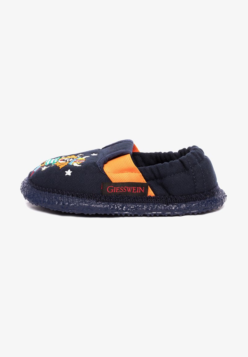 Navy textile slipper with elastic side, orange accent, and rubber sole. Features embroidered design of a playful character and stars.