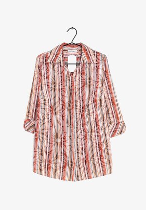 Koszula na długi rękaw z czerwonymi, pomarańczowymi i brązowymi pionowymi paskami oraz dużym kwiatowym nadrukiem, wisząca na czarnym wieszaku.