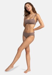 Brown textured bikini set featuring a simple design with a square neckline and adjustable straps, paired with low-rise bikini bottoms.