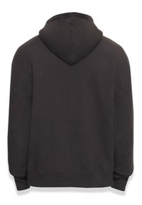 Sweat à capuche gris foncé avec une grande capuche, coupe ample, poignets et ourlet côtelés, fabriqué dans un tissu doux et texturé, sans logos ni motifs visibles.