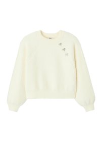 Sweat-shirt à enfiler de couleur crème, fabriqué en tissu duveteux, doté d'un col rond et orné de trois nœuds argentés décoratifs sur le devant.