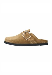 Tan suede slip-on shoe with a curved shape, featuring a silver buckle and decorative stitching on the side. Black rubber sole.
