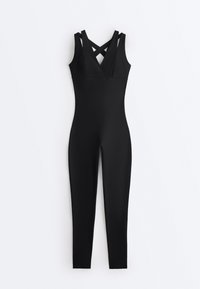 Black sleeveless fitted jumpsuit with V-neck and crisscross straps at the back, full-length slim legs, on plain white background.