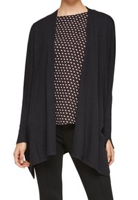 Black open-front cardigan made of a soft, lightweight material, featuring long sleeves and subtle side slits, layered over a patterned top.