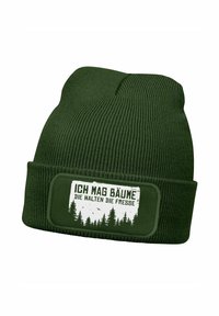 Green knitted beanie with a ribbed texture and a rectangular patch displaying white text and a forest graphic in the center.