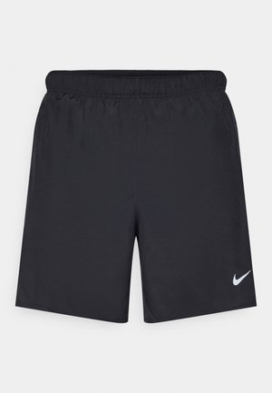 Fekete sportnadrág könnyű anyagból, rugalmas derékkal. A bal alsó oldalon egy kis fehér Nike-logó található.