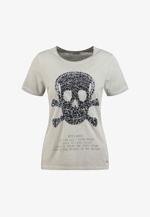 Hellbeiges Kurzarmhemd mit großem schwarzem Pailletten-Logo eines Totenkopfs mit gekreuzten Knochen und darunter gedrucktem romantischem Text.