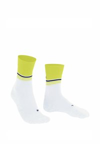 Białe skarpetki do kostek z jasnobrązowym ściągaczem. Ozdobione trzema poziomymi paskami w żółtym i granatowym kolorze blisko góry. Miękka tekstura.