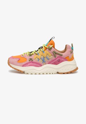 Chunky sneaker with pink, orange, and yellow panels, green and blue accents, thick white sole, and multi-colored laces.