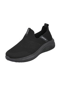 Zapatilla deportiva negra tipo slip-on con parte superior de tejido texturizado, gomas elásticas para un fácil calzado y suela de goma acolchada.