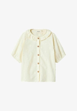 Dzeltena īsām piedurknēm blūze ar krokotu apkakli, priekšējiem pogām un strukturētu punktiņu rakstu uz mīksta auduma.