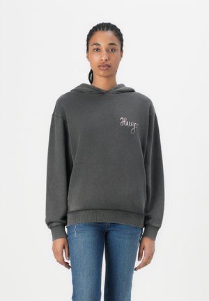 Charcoal gray hooded sweatshirt made of soft fabric, featuring a front pocket, ribbed cuffs, and subtle embroidered "Hugo" logo on the chest.