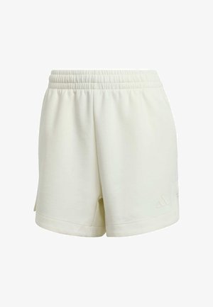Kremowe bawełniane szorty z elastycznym pasem, bocznymi rozcięciami oraz teksturowanym logo Adidasa na dolnym brzegu. Miękka tkanina o gładkim wykończeniu.