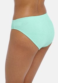 Světlounce zelené bikiny s vysokým pasem a texturovaným vzorem. Tkanina má mírný pružný povrch a hladký, jemný dotek.