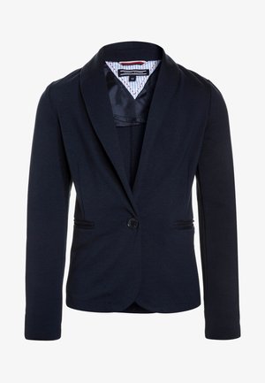Blazer aderente blu navy con chiusura a un bottone, revers con intaglio e fodera interna della cintura a righe.